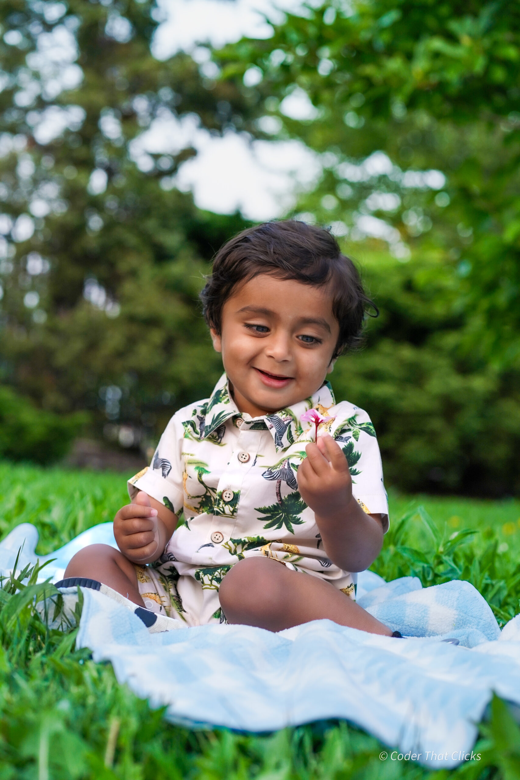 Toddler sitting on grass Brampton photography
